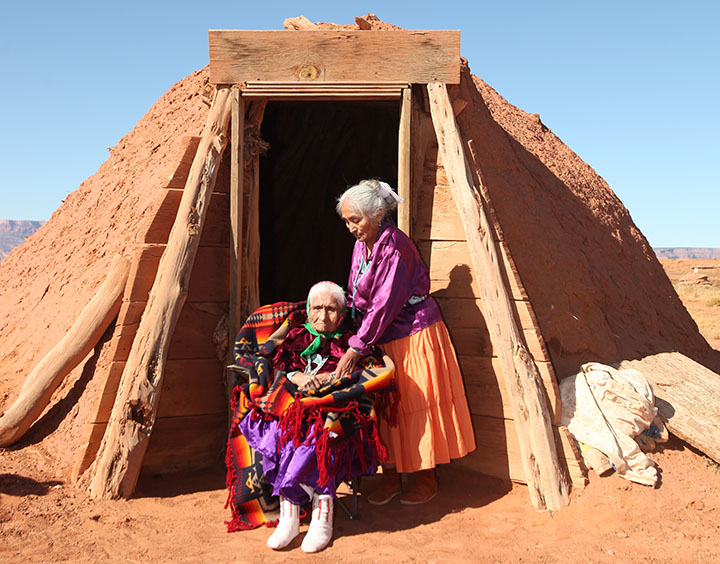 Two Navajo Women Outside Their Hoga