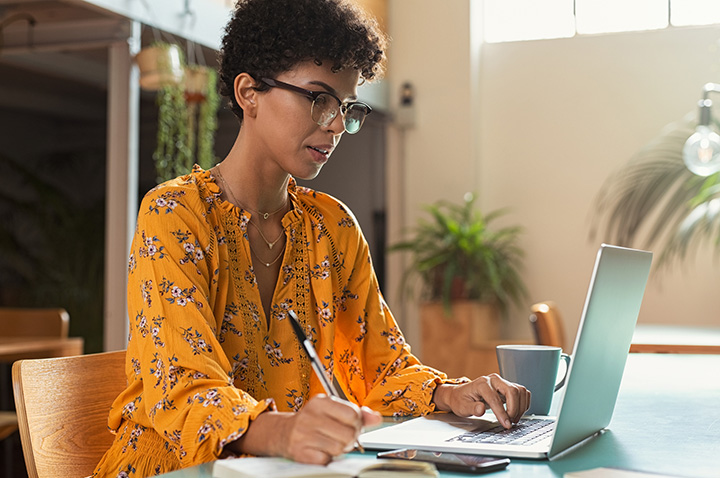 Woman writing down in text citations in apa format