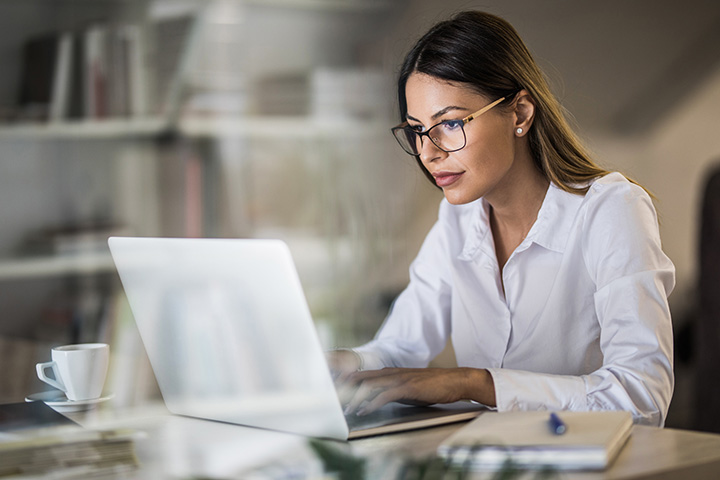 Woman creating citations on her laptop